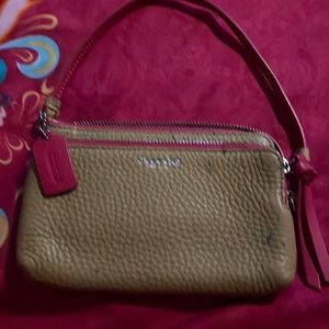 Coach Wristlet has a few pen marks